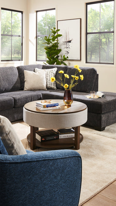 Table à café ronde rustique Elroy de 33 po avec dessus relevable, rangement, tablette et roulettes - brune et grise avec bordure en tissu